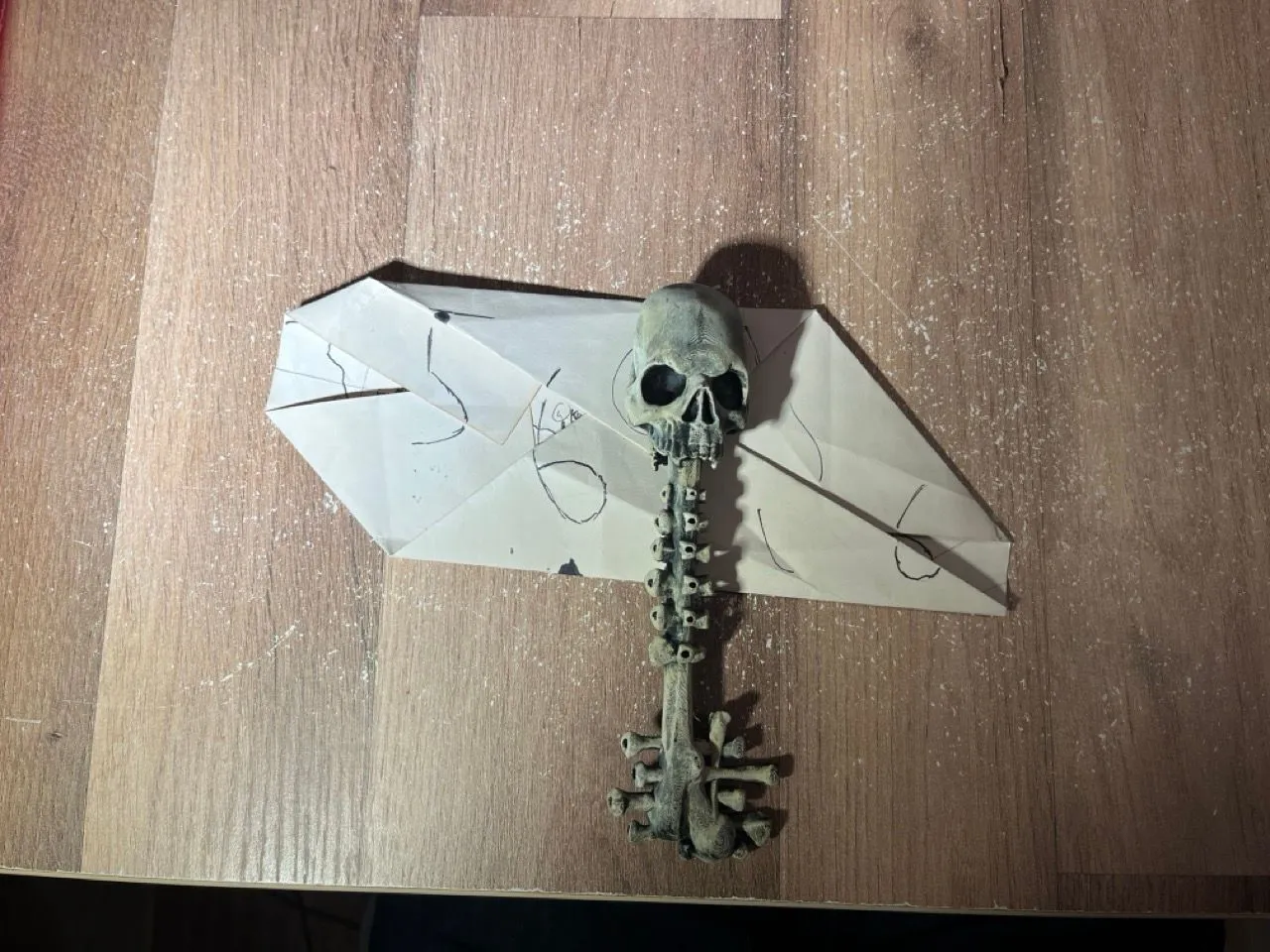 The map front, back, and folded to reveal the code