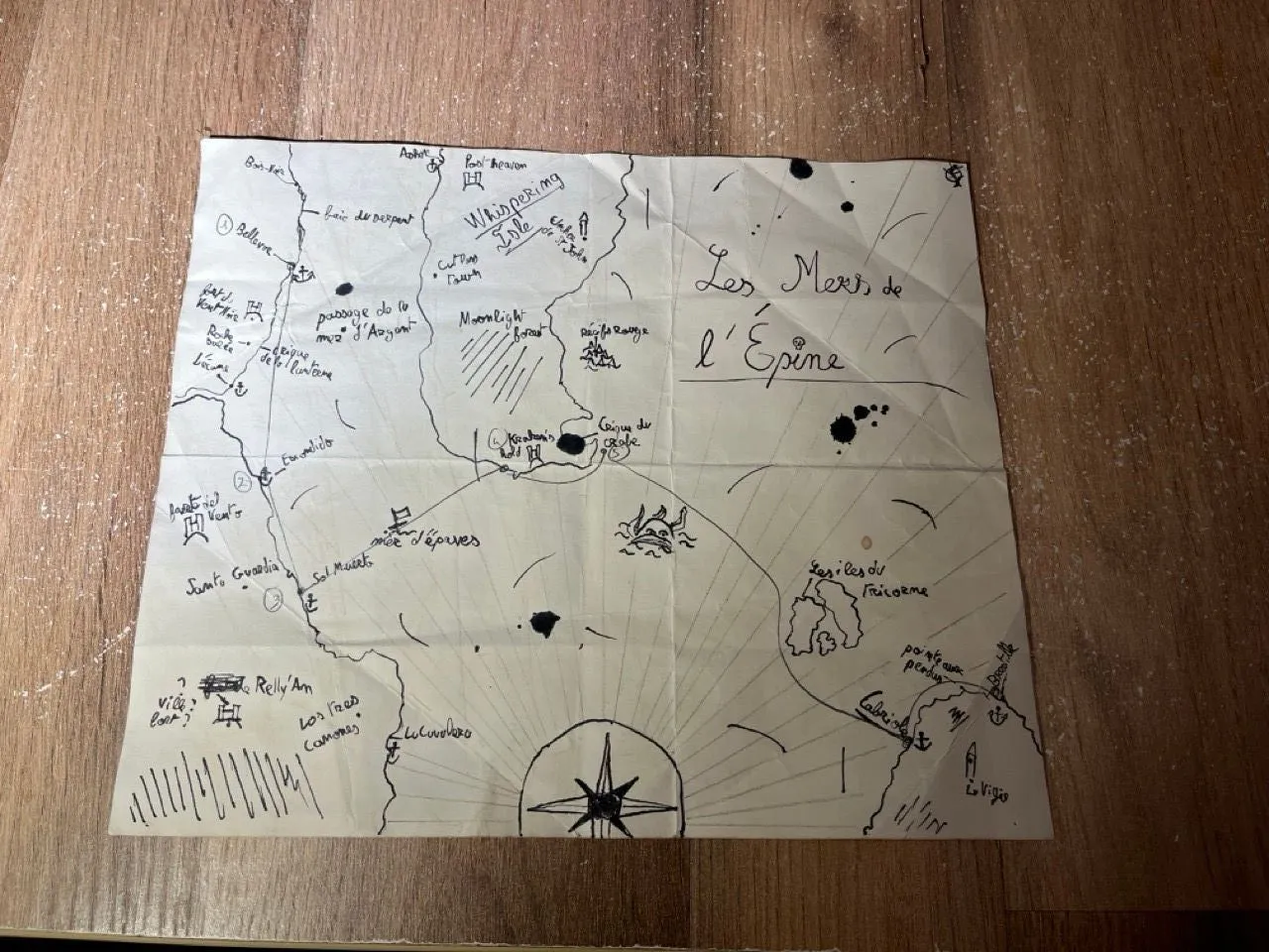 The map front, back, and folded to reveal the code